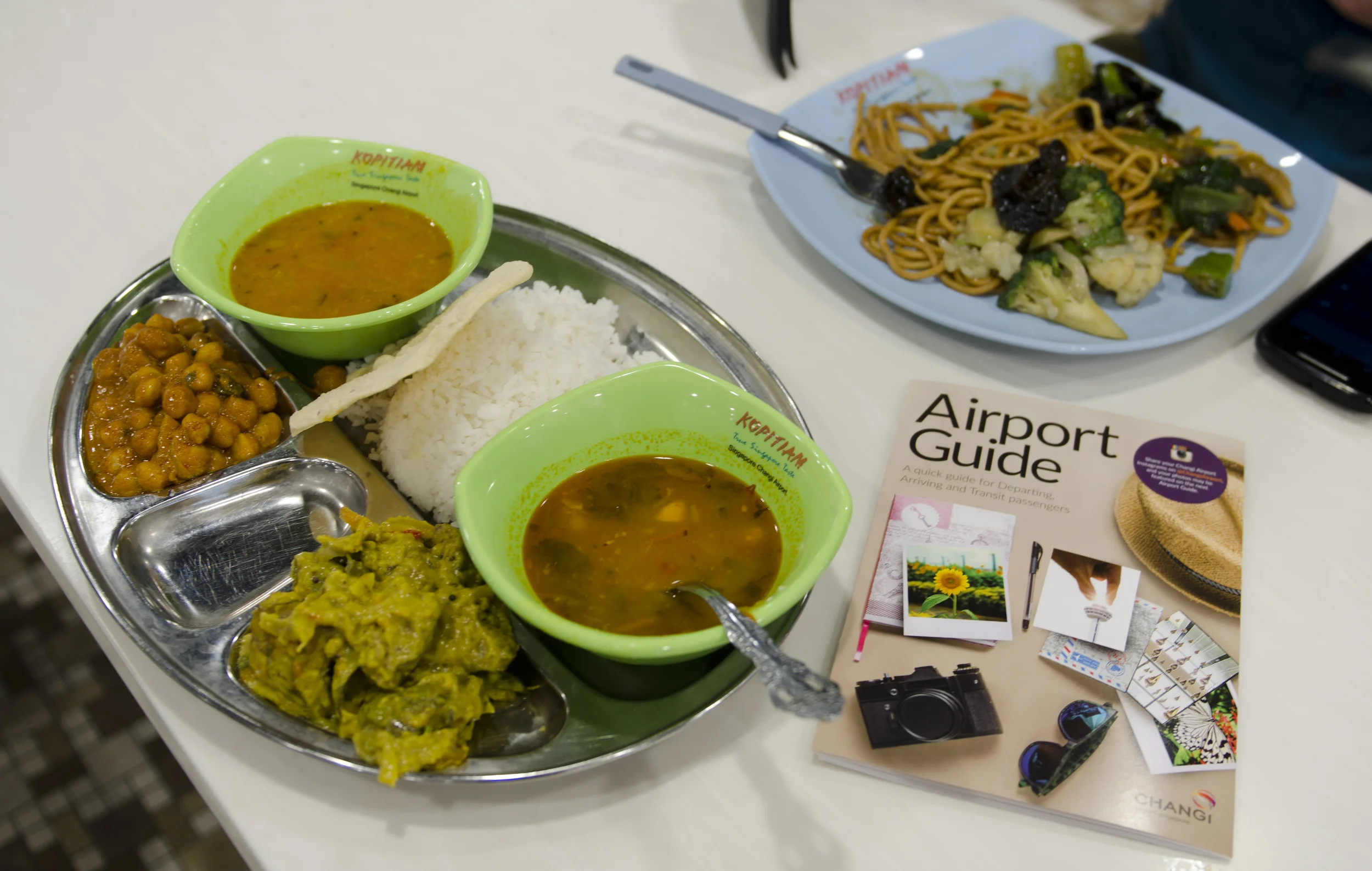 Changi also has loads of delicious food, and it's actually affordable unlike most airport food. I got all that incredible Indian food on the silver tray for just $4 USD! And how many airports have you been to that offer airport guides? Seriously, just go! 