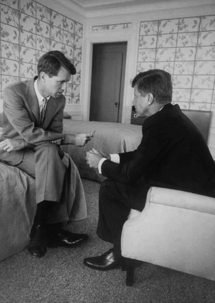 jackandjackie:
Sen. John Fitzgerald Kennedy and brother Robert F. Kennedy conferring in hotel suite during a convention stop ~ July 1960
Just a lil note re: body-language… I’ve been reading up on it a lot lately and can’t help but notice the boys p…