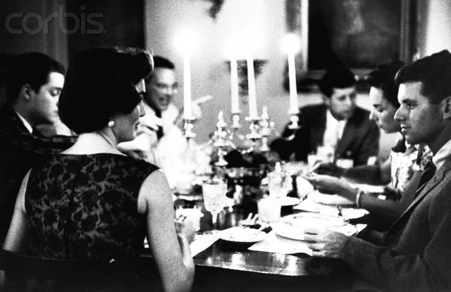 jackandjackie:
Jackie and her brother-in-law Bobby at a dinner party hosted by the Kennedys in Georgetown. Jack, Ethel and Lem Billings are further down the table ~ June 3, 1957