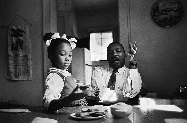 King said in an interview that this photograph was taken as he tried to explain to his daughter Yolanda why she could not go to Funtown, a whites-only amusement park in Atlanta. King claims to have been tongue-tied when speaking to her. “One of the…