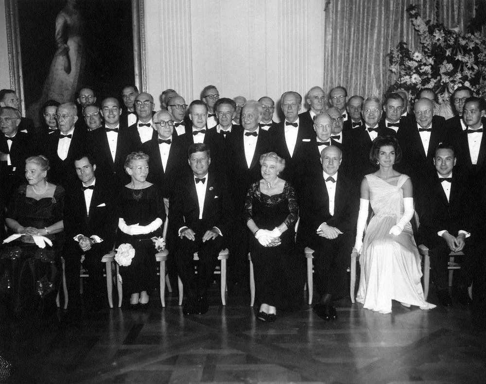 jackandjackie:

President and Mrs. Kennedy host a State Dinner in honor of 49 Nobel Prize Winners from the Western Hemisphere: East Room, White House, Washington, D.C. ~ April 29th, 1962
(L-R) Seated in front row: Pearl S. Buck; Dr. Rudolf L. Mossba…