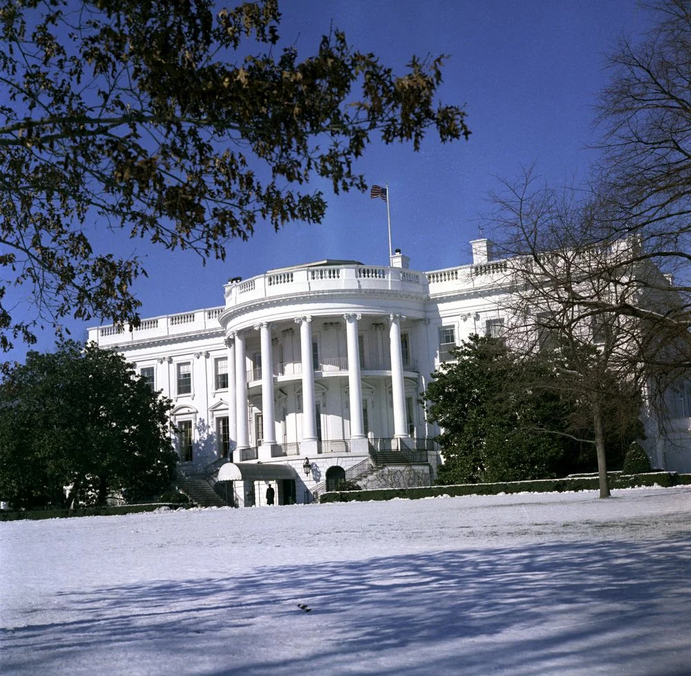 ourpresidents:
Snow on the White House Lawn
South entrance of the White House, including the South Portico, as seen from the snow-covered South Lawn. Washington, D.C.  2/10/62.
For those of you experiencing the Snowquester storm around D.C., have f…