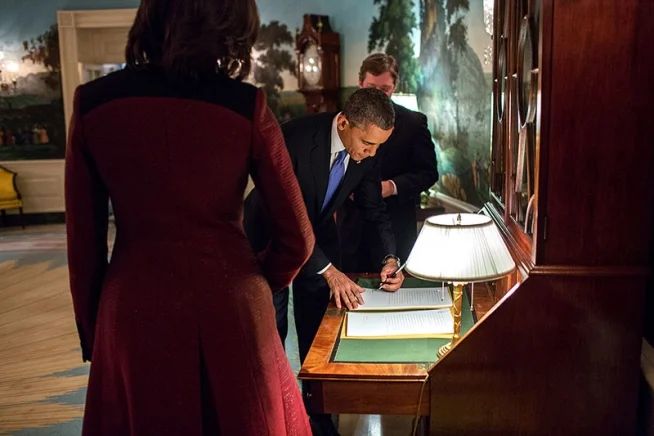 obamafamily:
President Barack Obama signs two copies of his State of the Union address in the Diplomatic Reception Room of the White House before departing for the U.S. Capitol, D.C., Feb. 12, 2013. First Lady Michelle Obama and Staff Secretary Dou…