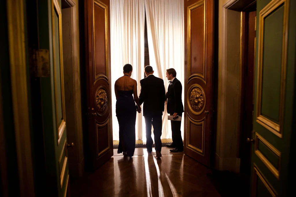obamafamily:
Joe Paulsen, White House Advance Office site lead, holds the curtain for President Barack Obama and First Lady Michelle Obama as they are introduced during the Pritzker Architecture Prize award ceremony at the Andrew Mellon Auditoriu…