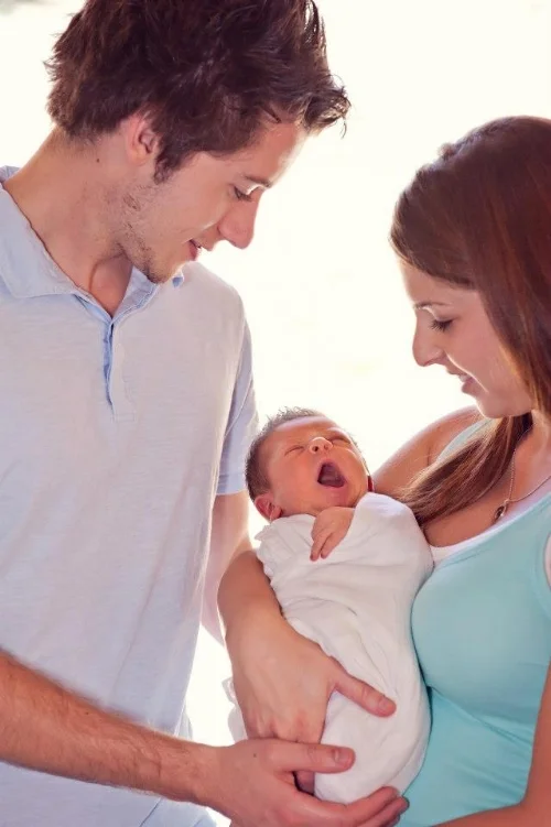 Smiling in this picture but silently suffering. Ironically, the picture below with me holding Max I am not smiling but was filled with nothing but joy.