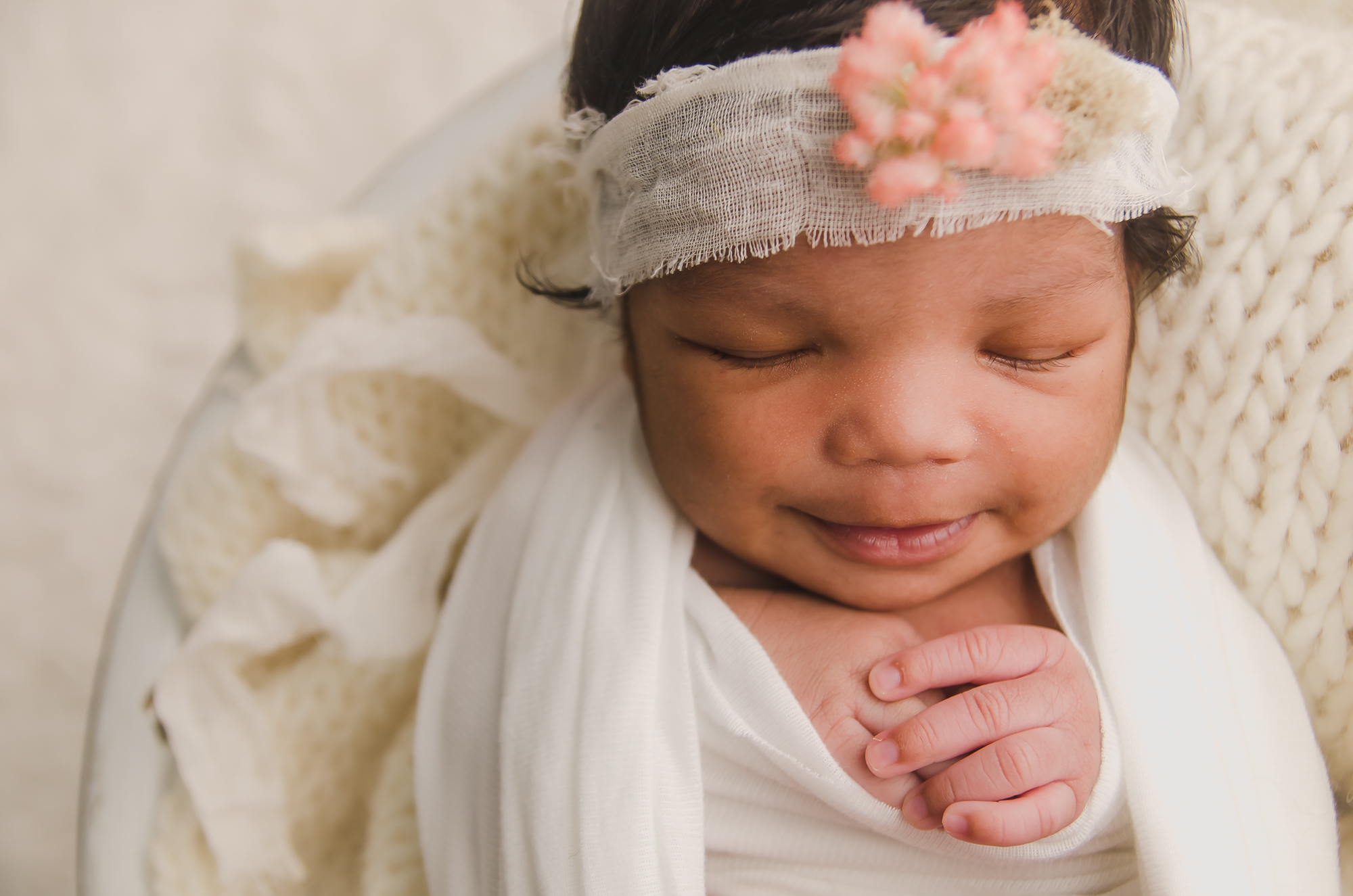 Some of the newborn props, bonnets, tiebacks, and layering blankets for use during newborn sessions.