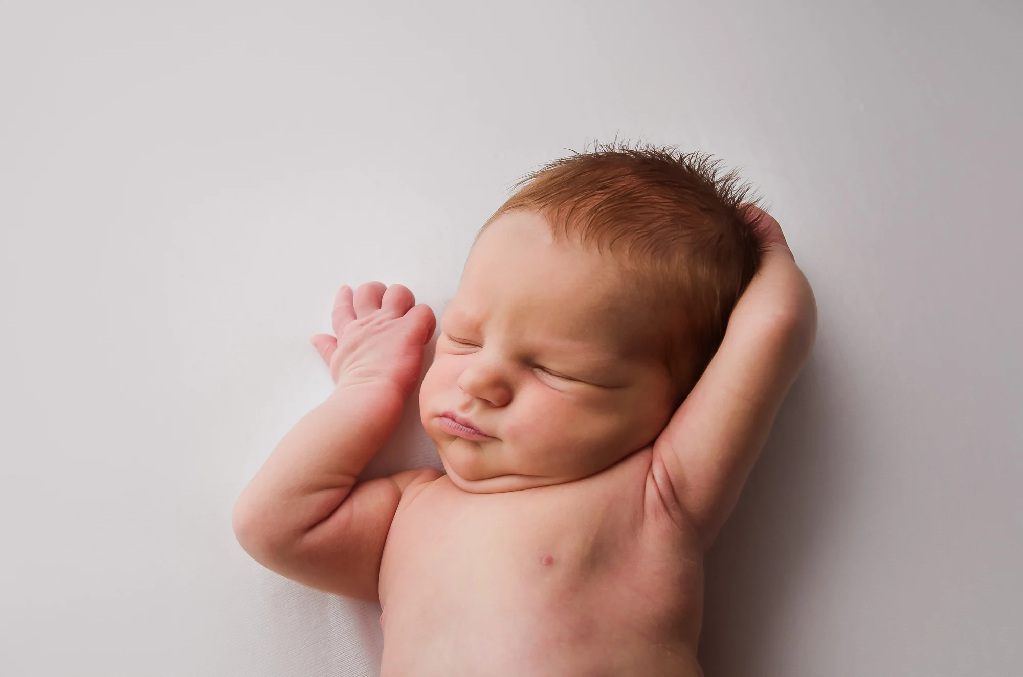 newborn girl stretches in her sleep, Indianapolis, IN