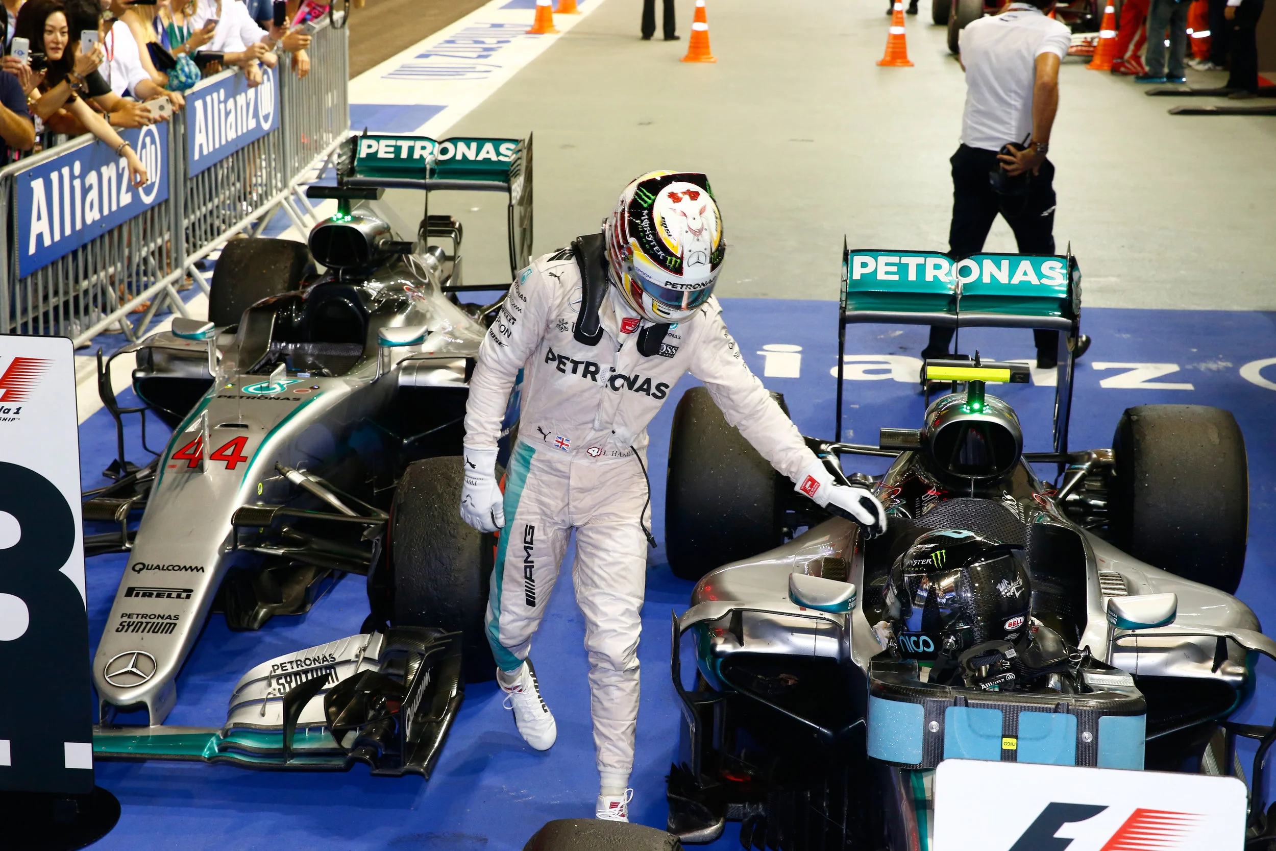 Hamilton congratulates Rosberg, or possibly tries to flick his ear. (Pic: Mercedes)