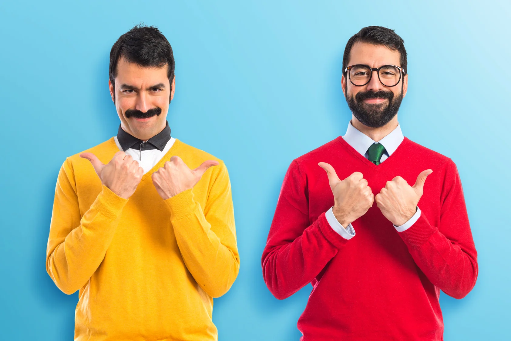 Twin brothers with thumb up