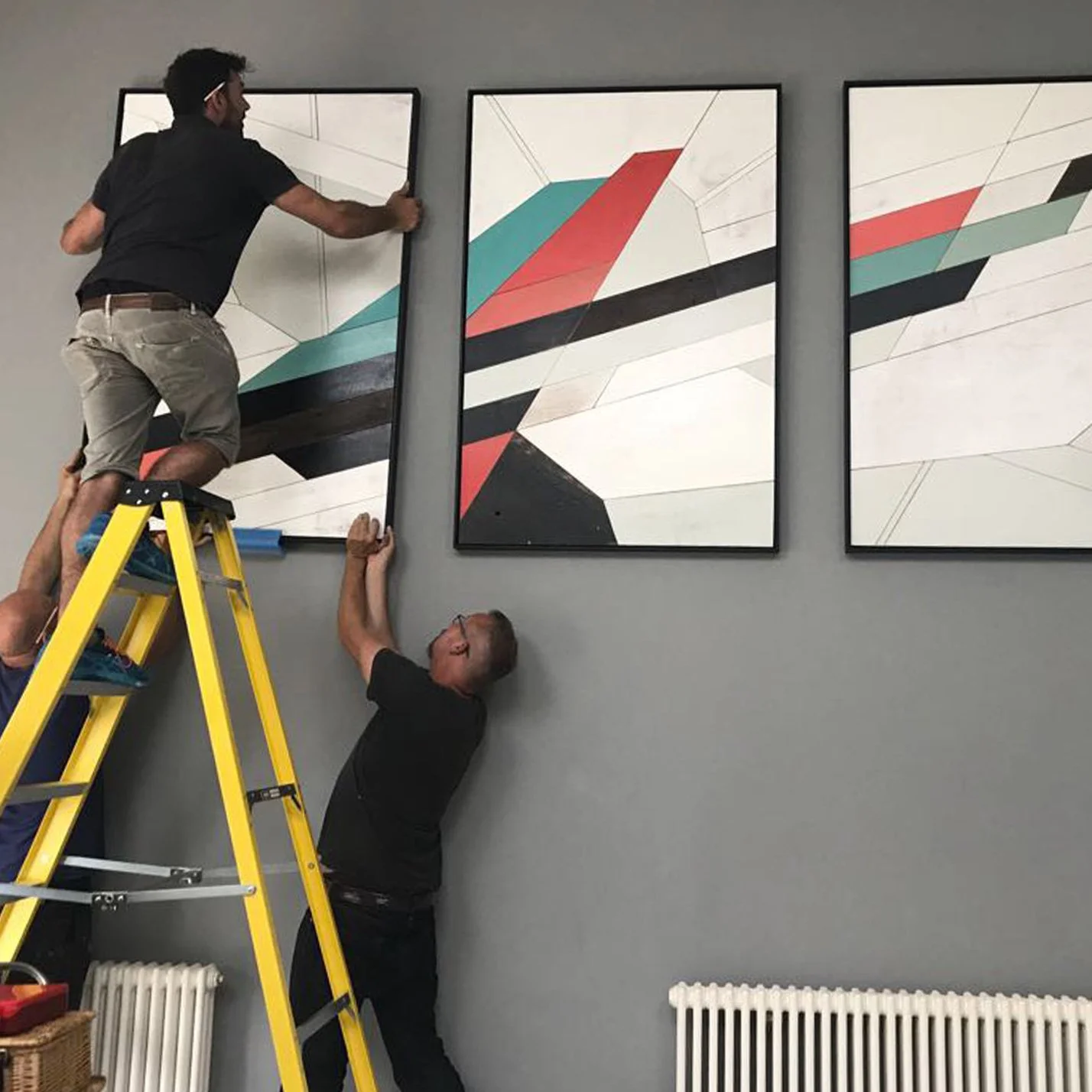 Installing a triptych commissioned by interior designer for North London home.