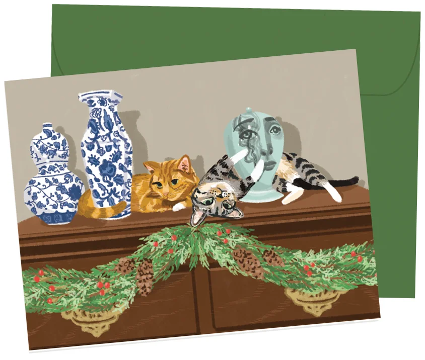 Ginger & Tabitha | A greeting card of the family's cats lounging at home, inspired by an Instagram photo of Ginger. I loved including a corner of the couples home and the subtle nod to their life of travel and art appreciation, with a just a little bit of holiday cheer mixed in. A2 greeting cards, blank interior, professionally offset printed