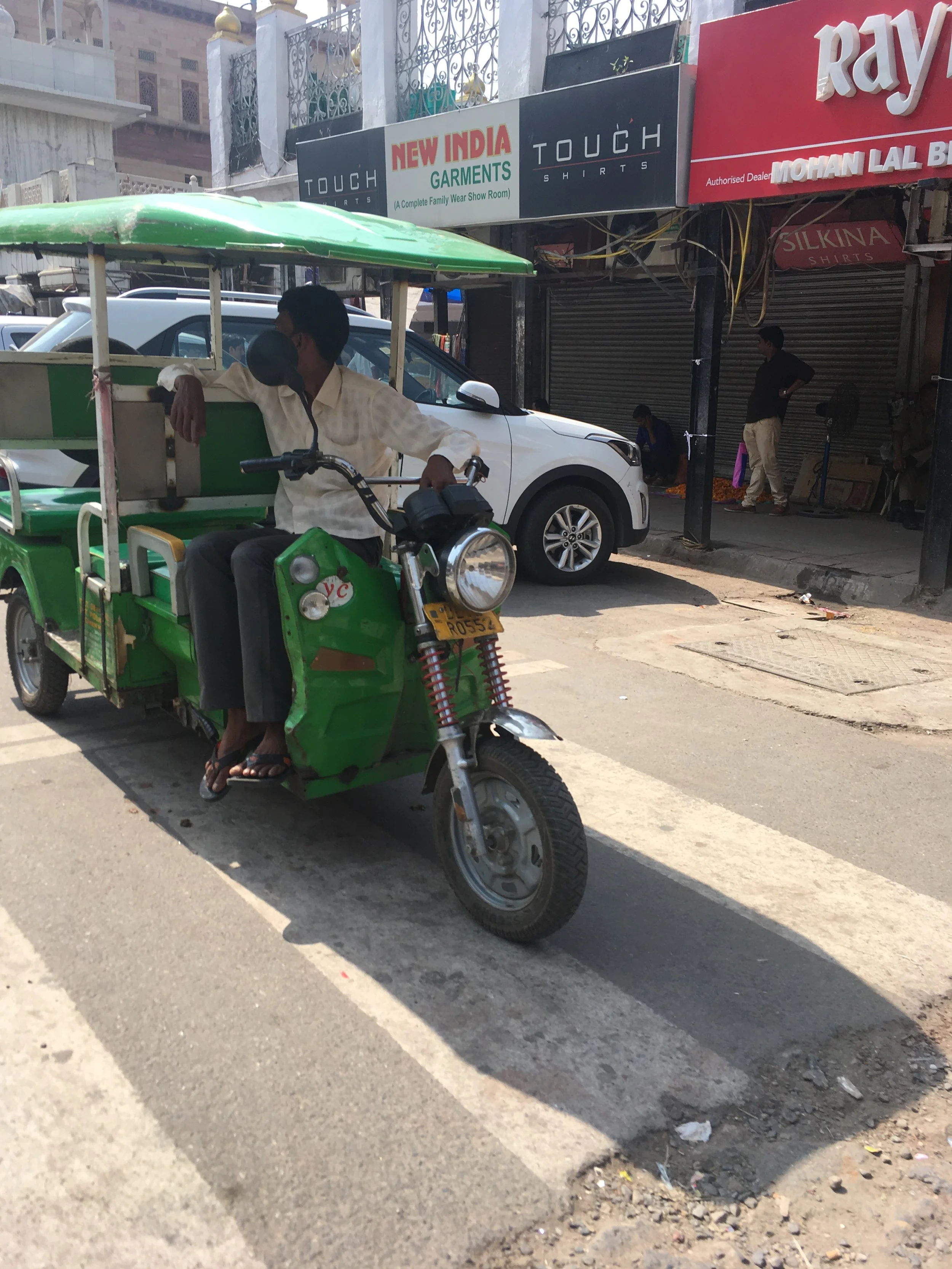 An e-rikshaw. This is a shared rickshaw that usually goes for Rs 10 per seat. 