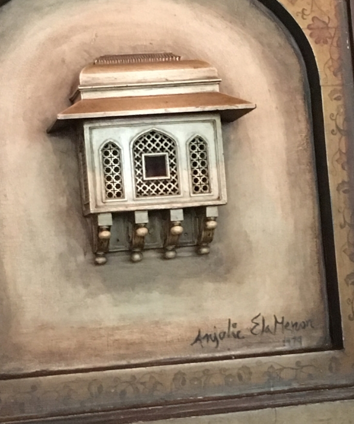 A close up of Anjolie Ela Menon's signature on her work at Varq