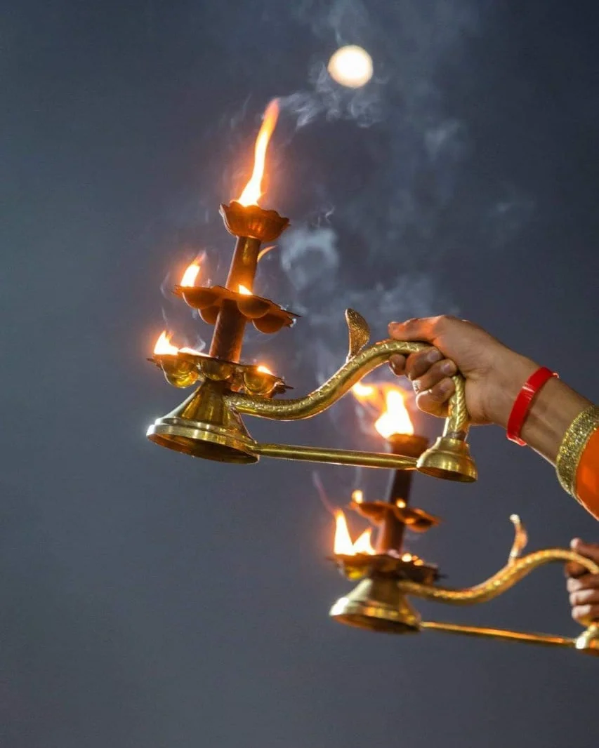 Aarti of the holy river Ganga being conducted at dusk, on the banks of the river