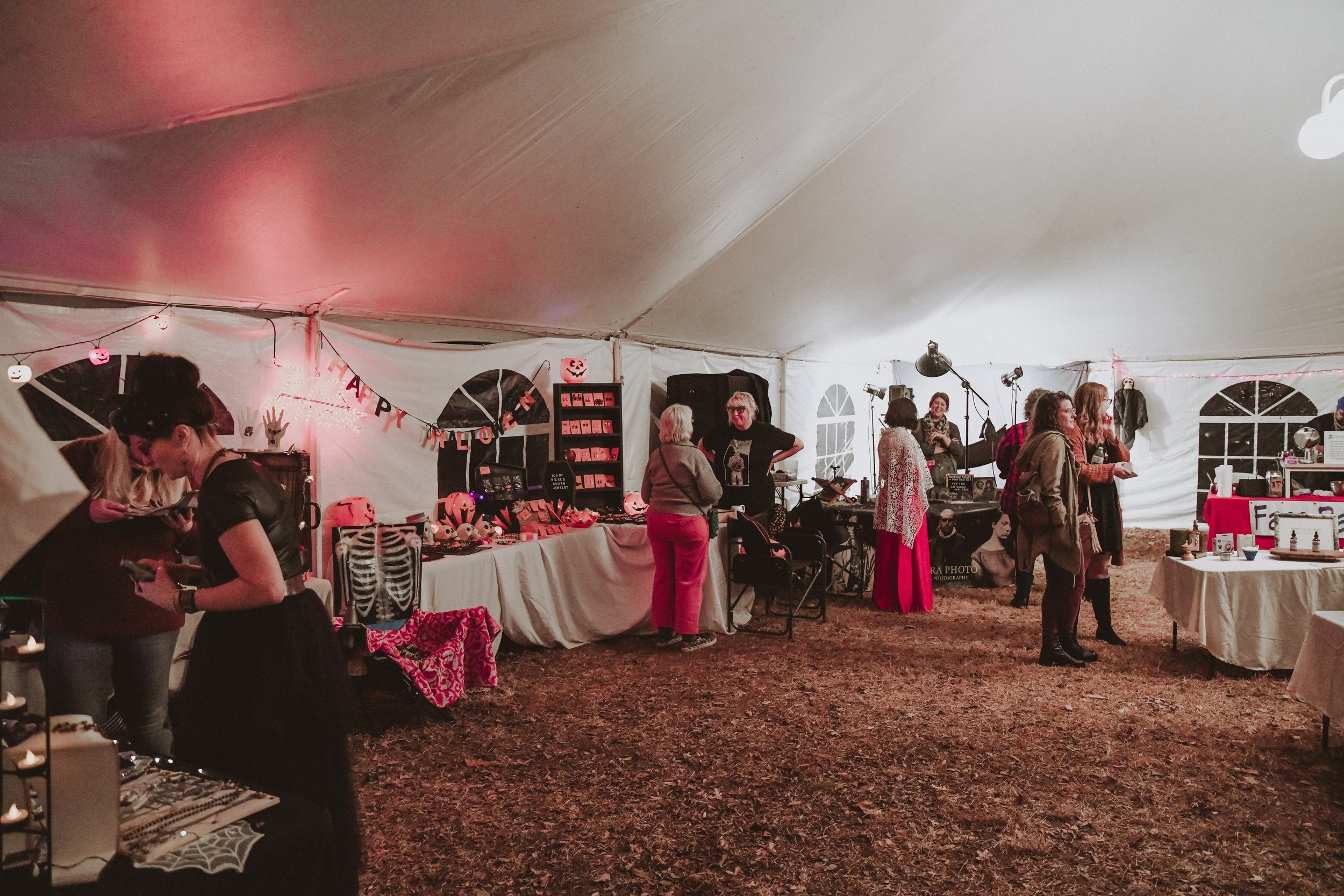  Attendees visit vendors and tarot readers. Photo  @awsnapshots  