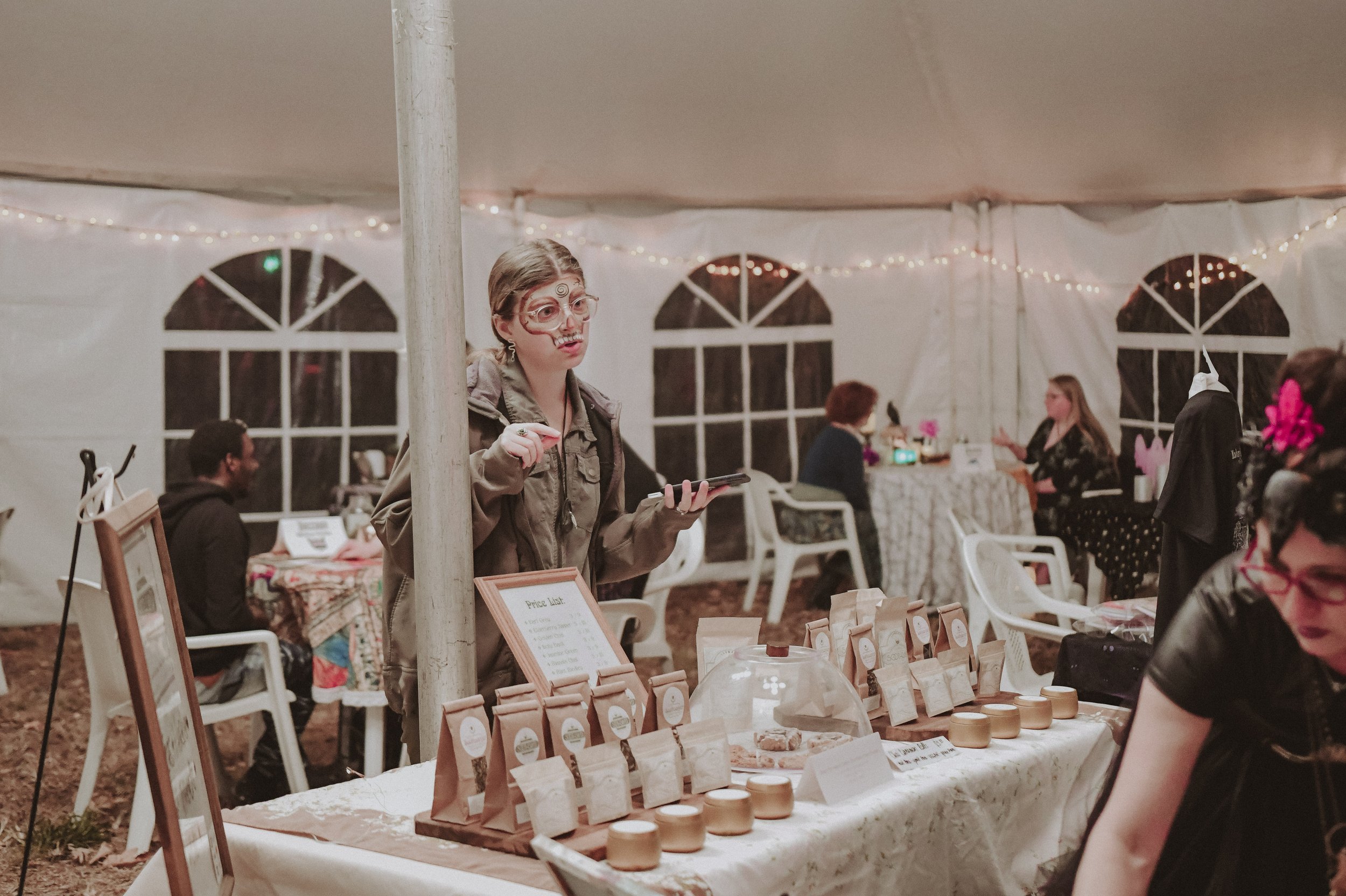  Herbalist Courtney explains her offerings. Photo  @awsnapshots  