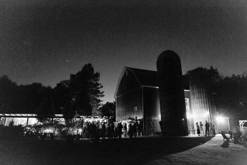 Black and white photo of the wedding barn at night
