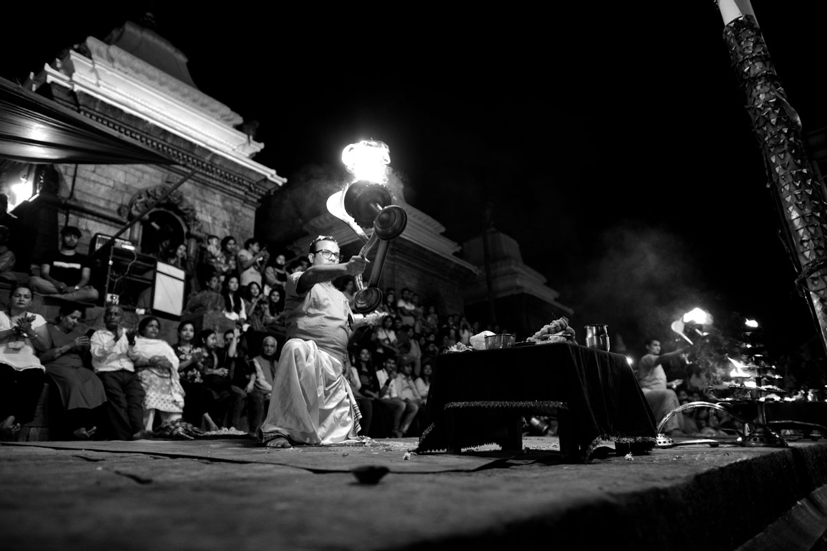 Aarti in Pashupatinat, on the banks of the Bagmati River, the fire (Agni) primarily connotes the fire as a god. Aarti is a Hindu religious ritual of worship.