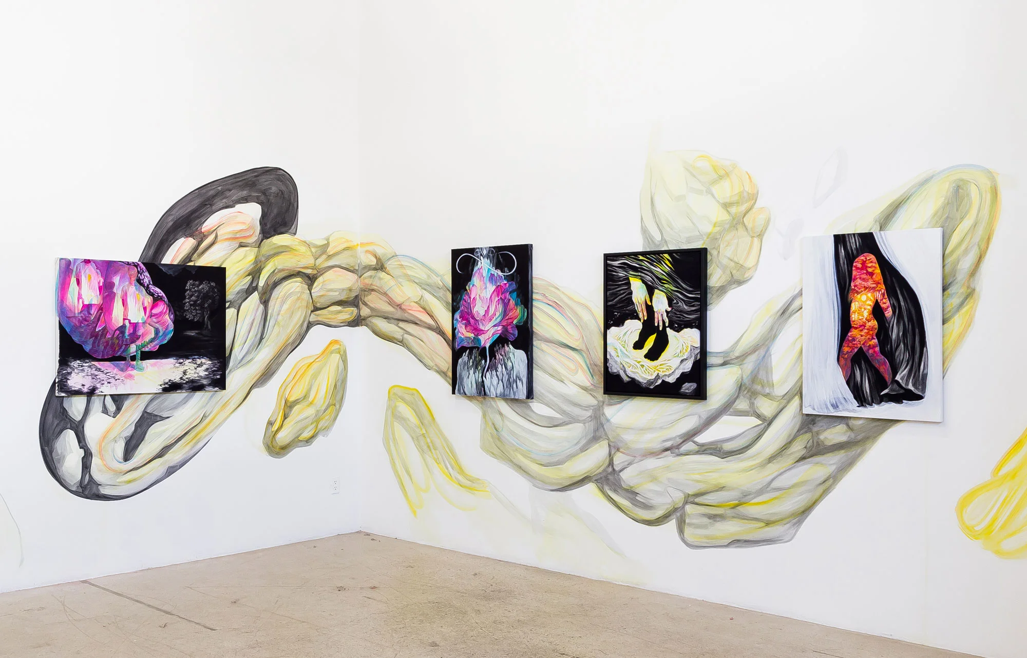 Installation of artwork over wall mural