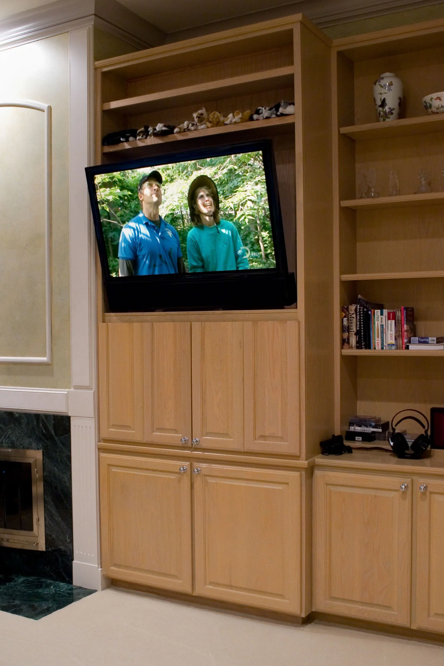 This flat-screen TV is mounted on an articulating arm that can be tilted and moved with a remote control.