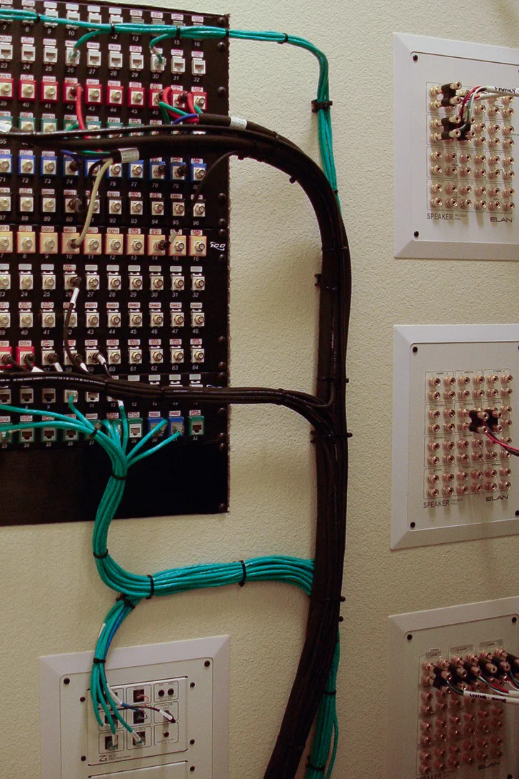 This client hired us to wire his new home for the future. We performed a future-proof prewire, and terminated all wires at this connection point. Wires are labeled and ready, but only a few are currently in use. This client was smart—he knew that getting the wires in the walls during construction would cost pennies on the dollar, when compared to waiting and retrofitting each time he was ready to add new technology. This panel makes it simple for us to add technology and make changes over time. Over the years, this client client has activated technology in previously dormant rooms as his family grew. Wire for later and activate for now . 