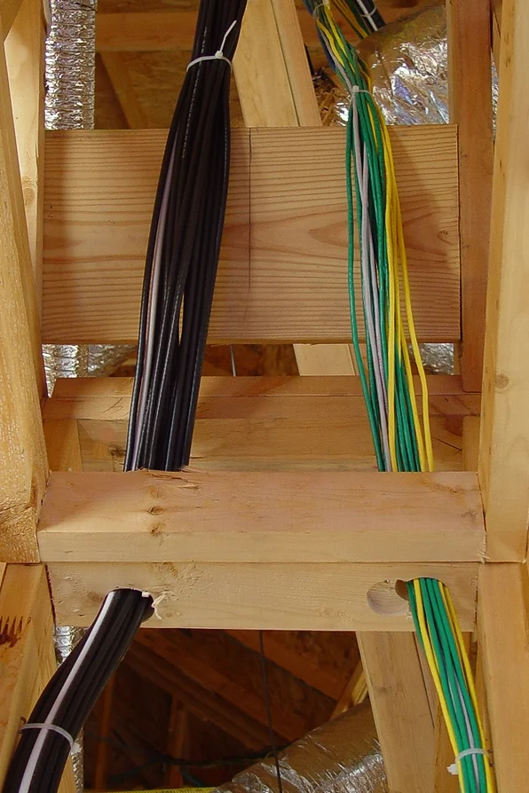 We created a "chase" away from the one the electrician was using, separating our audio and video from each other to prevent cross talk. Running wires like this also keeps them safe from the traffic of other trades, preventing damage to the wire over time. You can do it right, or it's wrong. There is no grey, or "kind of good" when it comes to a prewire. Just because a mediocre prewire works today doesn't mean it will work later. Thirty-foot wire runs that free-hang across an attic won't last long. Also, tight wire won't last.