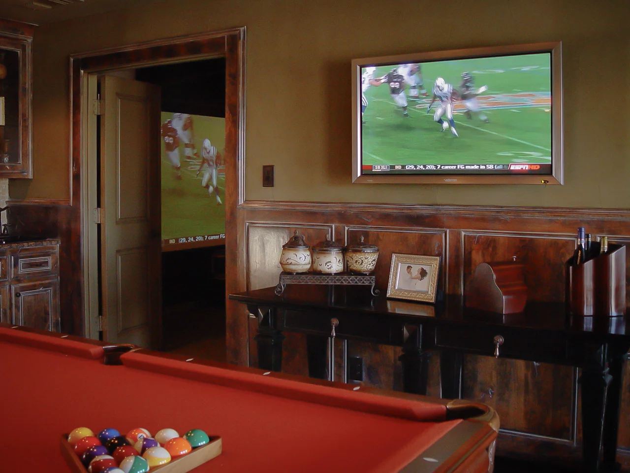This is one of the model home theaters we designed and installed for Darling Homes in Frisco, Texas. We designed a full-on home theater, and a game room just outside it.
