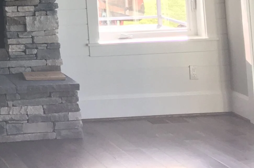 Let's play "Spot the 12" subwoofer in this picture.” Hint: It's not in the in-floor heat register. It's only one example of how high-performance audio needn't intrude.