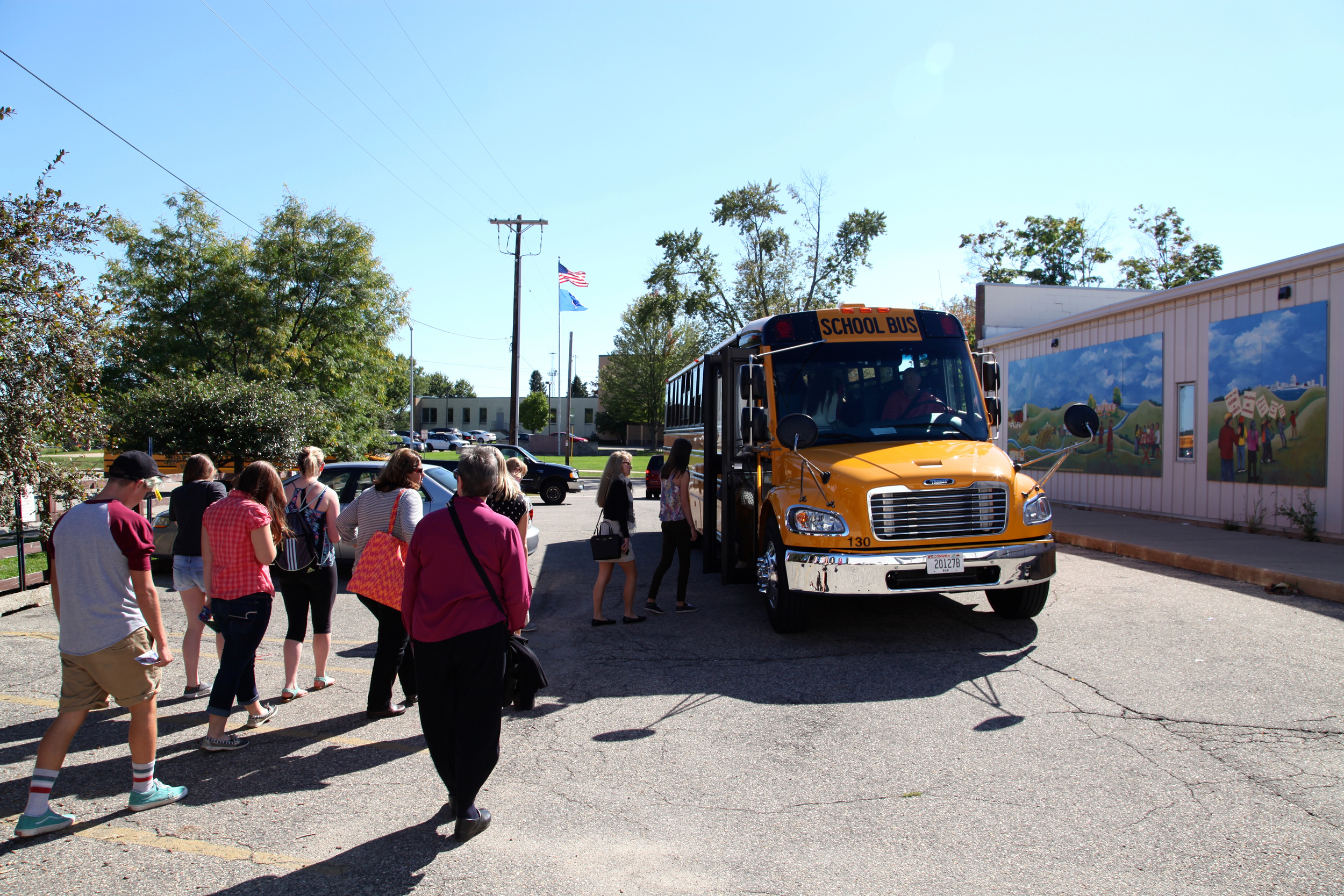 Boarding the bus outside Centro Hispano in Madison. 