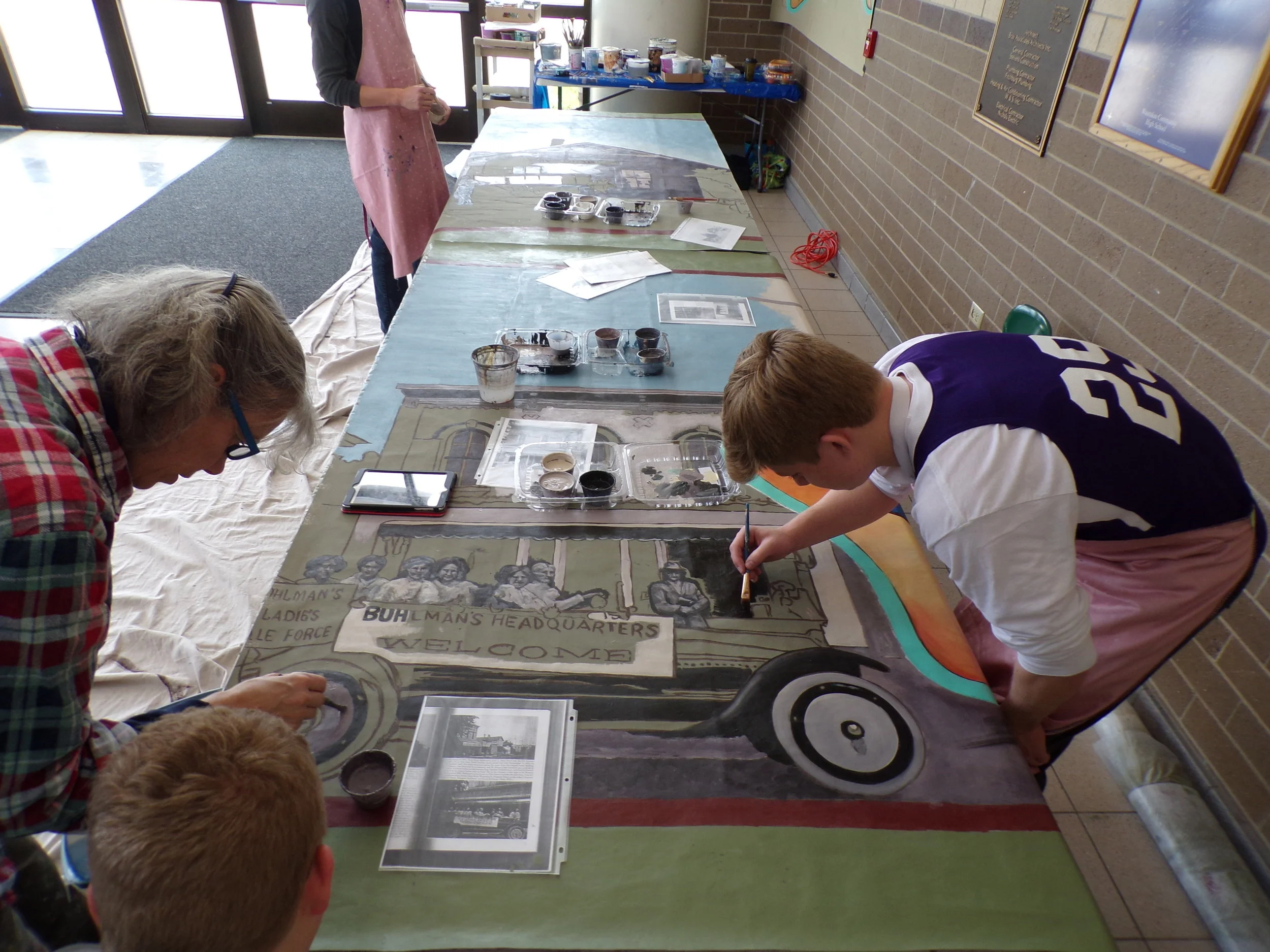 PAINTING THE WAUNAKEE MURAL at the shop