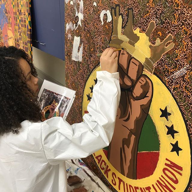 Painting with Verona Area High School Students (Black Student Union). The four 4x4ft panels depict the Past (Africa) and the Present (here) imageries.
This is the first time we are exploring painting a mural on African fabric. The Nigerian fabrics ar