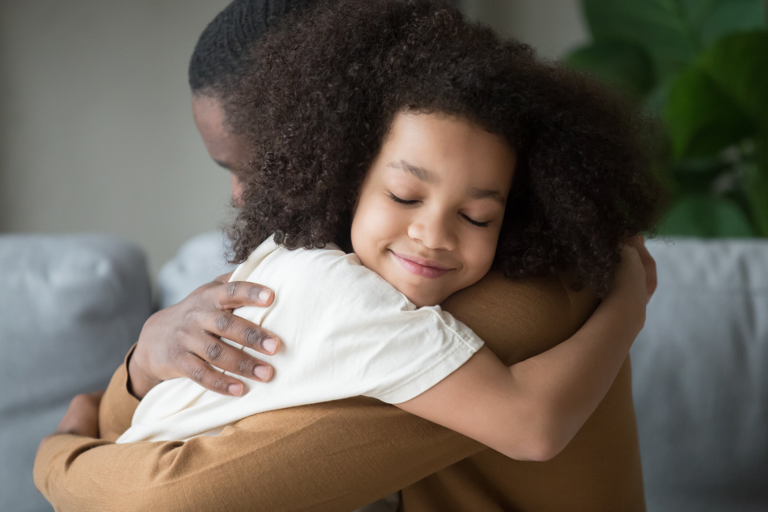 Man hugging little girl