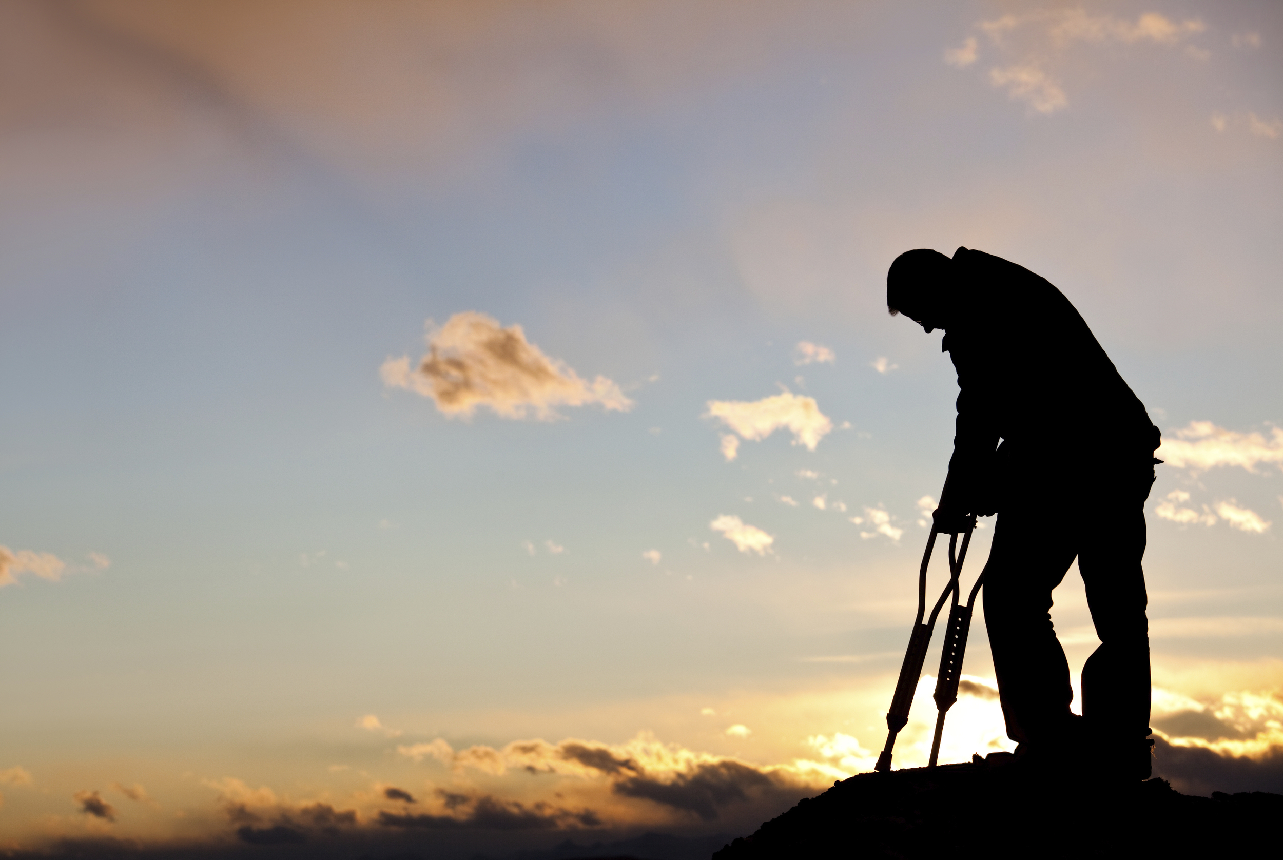 http://www.istockphoto.com/photo/silhouette-of-a-sad-injured-man-with-crutches-18496949