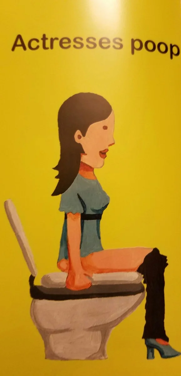 Olivia Munn on a toilet.
