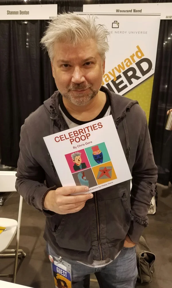 Chris Gore and his book Celebrities Poop at Phoenix Comic Con 2016.