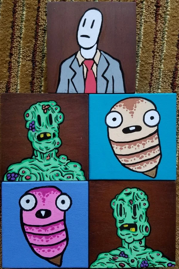 Paintings by Adam Yeater on canvas and wood blocks.