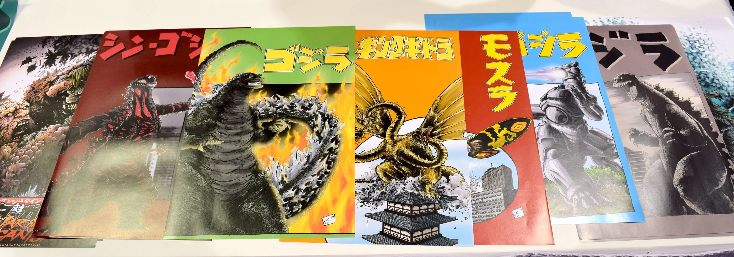 Kaiju posters at the Kodoja table in Phoenix Comic Con 2017.