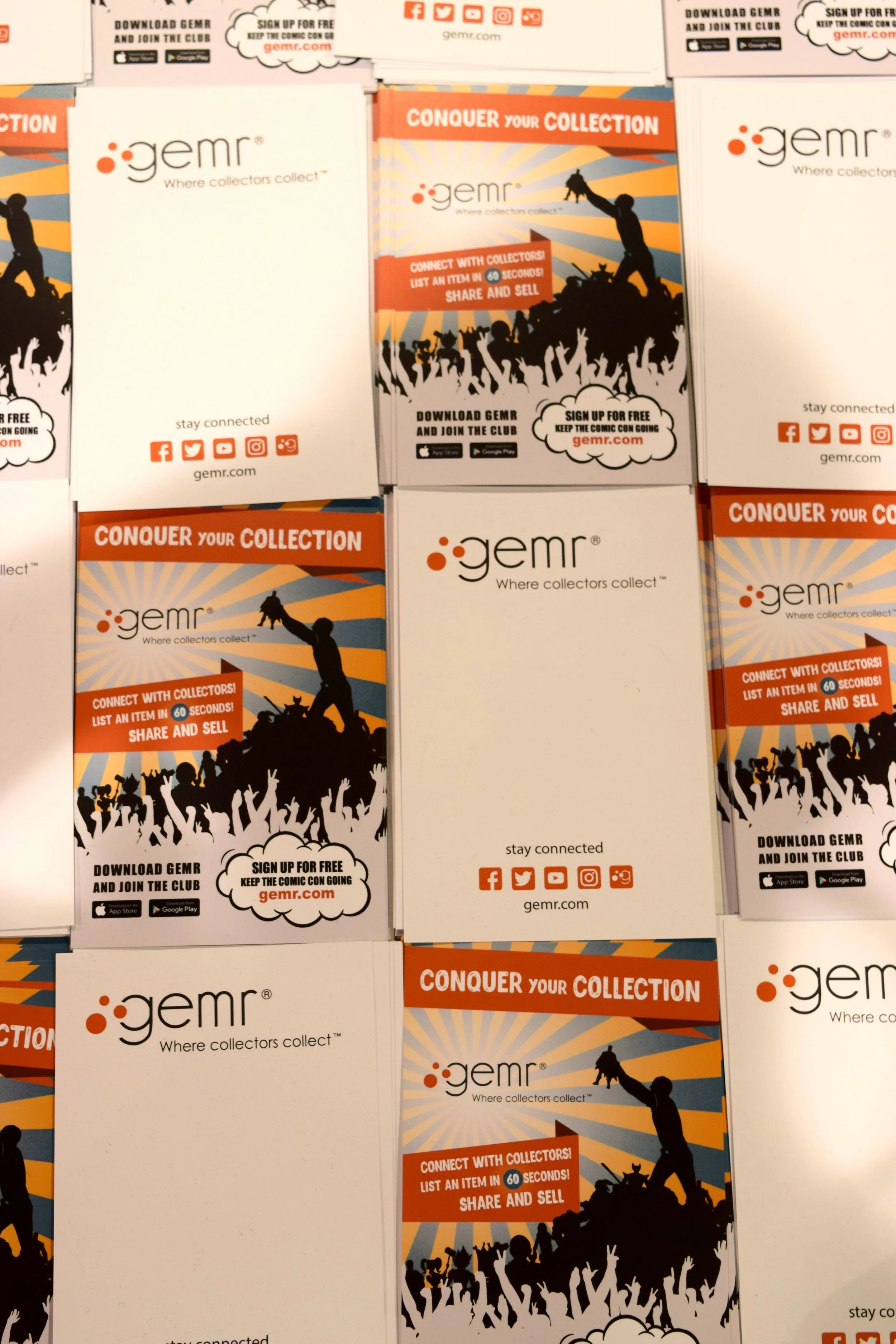 A table full of gemr.com flyers at Phoenix Comic Con 2017.