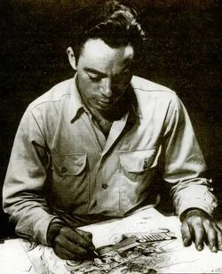 Sheldon Moldoff sitting at his drawing table.