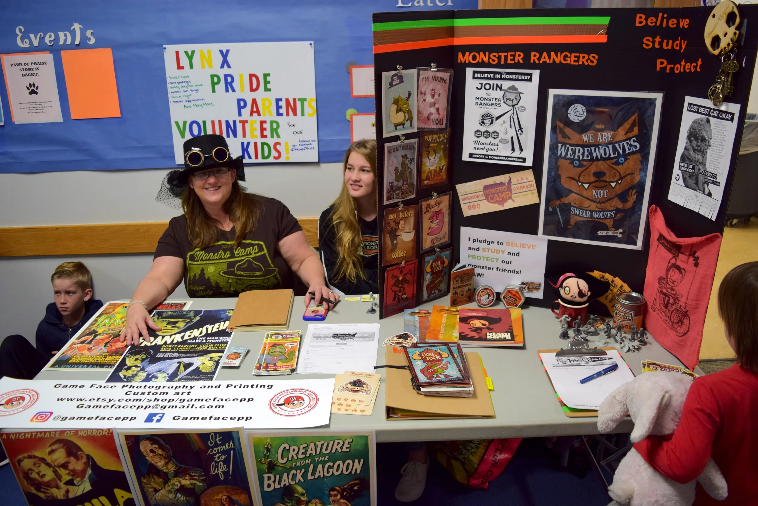 At the Game Face Photography and Printing table, with the Monster Rangers sign-up.