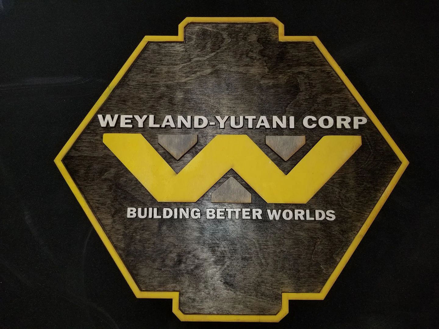 A Weyland-Yutani Corp placard from MacWolf Productions.