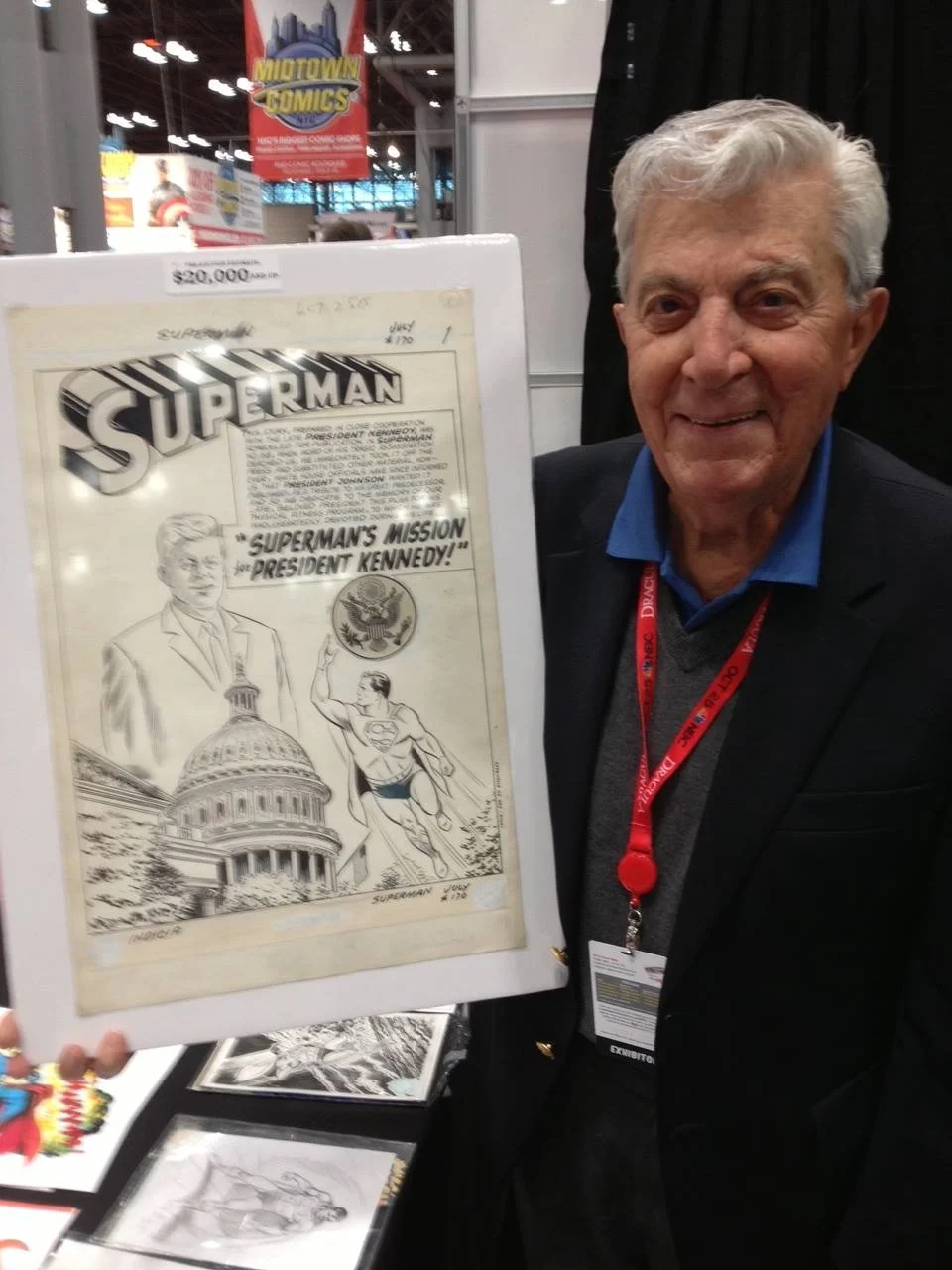 Al Plastino with the original art for his President Kennedy story in Superman (1939) #170.