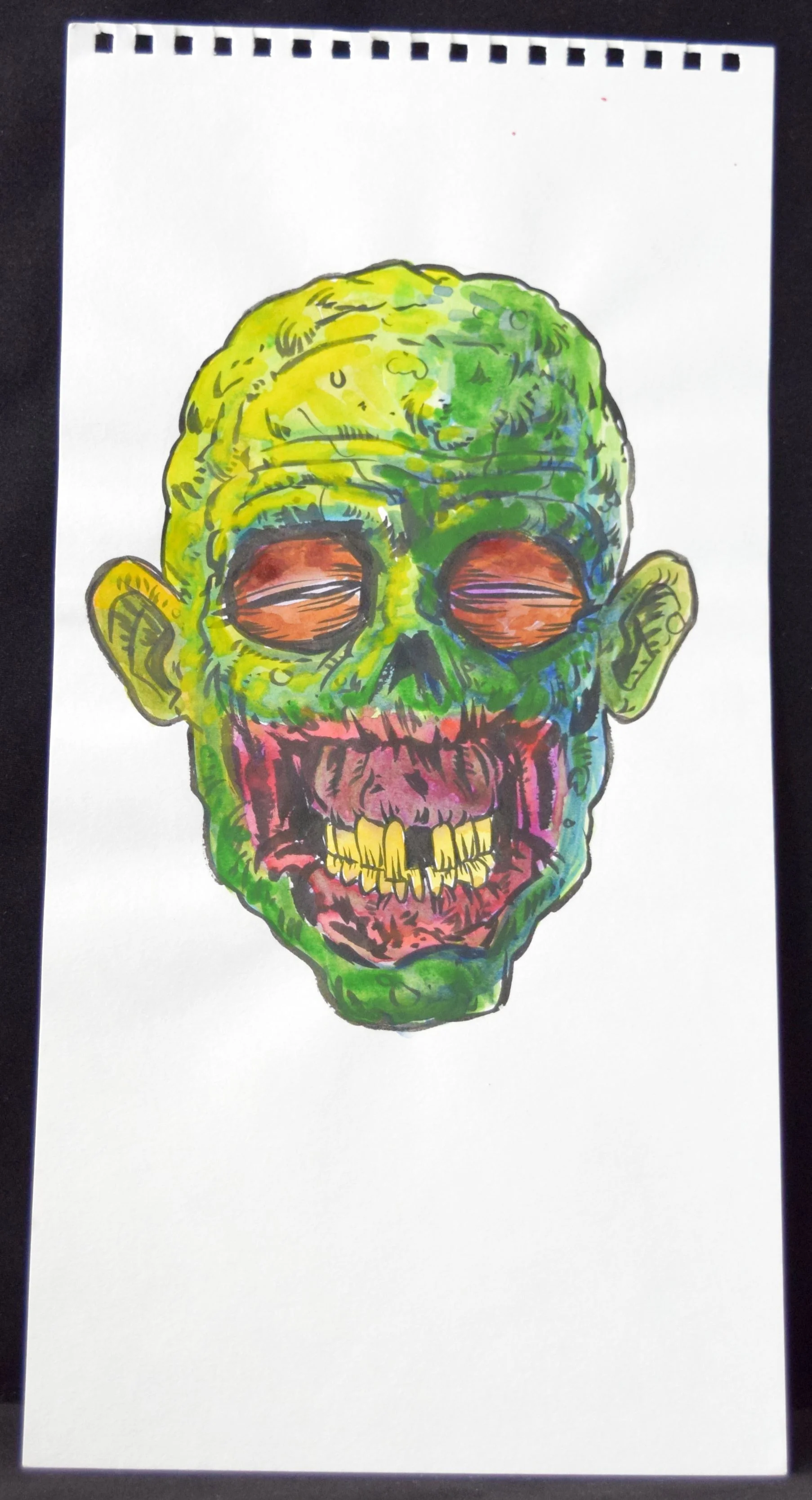 A zombie head from Joe Oliver .