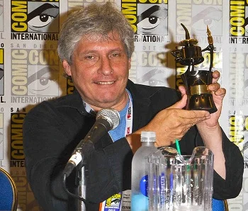 Elliot S! Maggin holding his Inkpot Award at SDCC 2013.