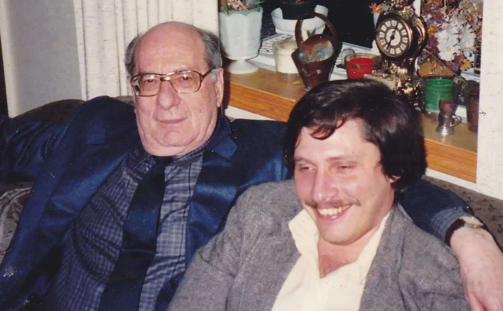 Julie Schwartz sitting with Elliot S! Maggin.