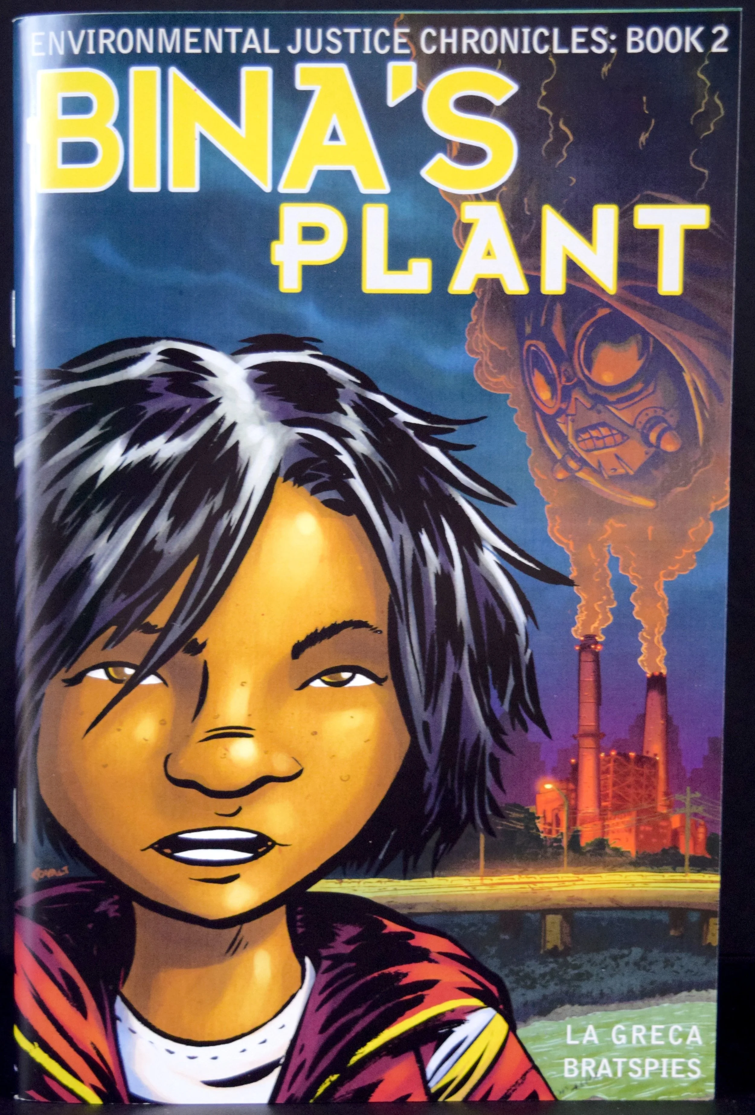 Environmental Justice Chronicles Book 2: Bina's Plant , written by Charlie La Greca & Rebecca Bratspies with art from Charlie La Greca .