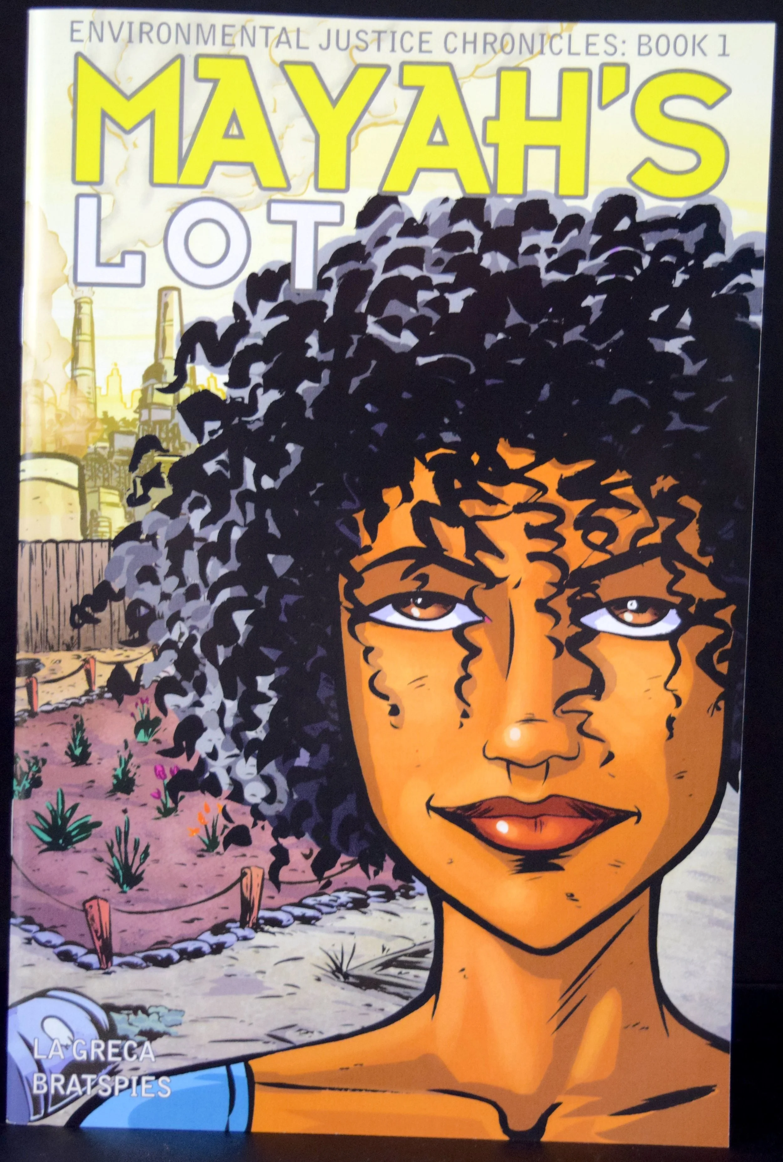 Environmental Justice Chronicles Book 1: Mayah's Lot, written by Charlie La Greca & Rebecca Bratspies with art from Charlie La Greca .