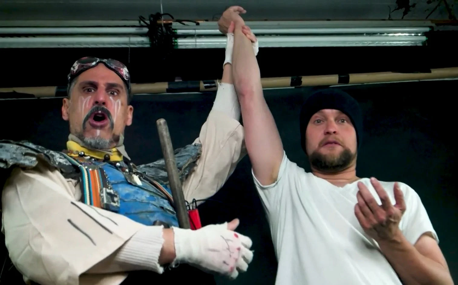 Hagar T. Mangtooth holds aloft the hand of Daniel Crosier , writer & director of Camp Crash !