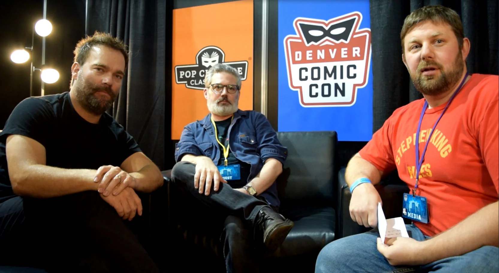 Andre Gower , Ryan Lambert , & Abrahm Akin sitting at Denver Comic Con 2018.
