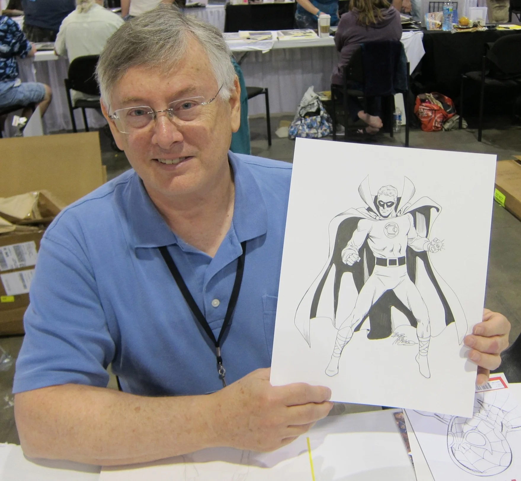 Bob McLeod holding a Green Lantern commission.